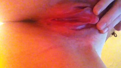 Rubbing her wet pussy