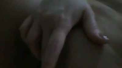 Older woman fingers her pussy