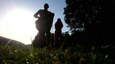 Mature nudist couple drying up against